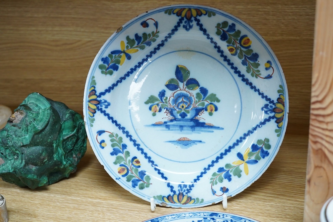 An 18th century Delft plate, two tin-glazed dishes and candlestick, a Gardener Russian porcelain tea cup and saucer, and a mug with liner, largest 22cm in diameter